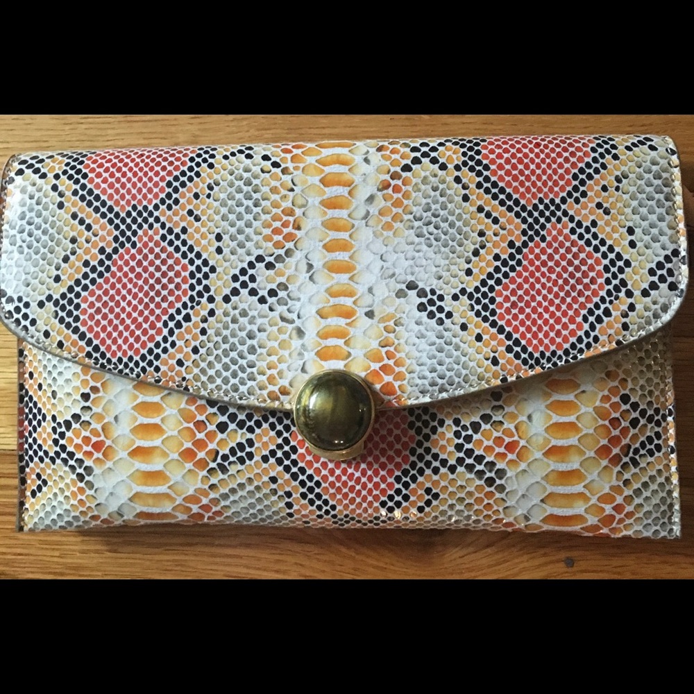 Sondra Robert Snakeskin clutch with long cross body strap.